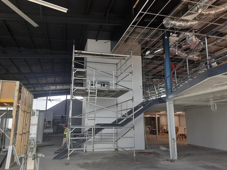 Mezzanine level and structural steel painted in a commercial facility