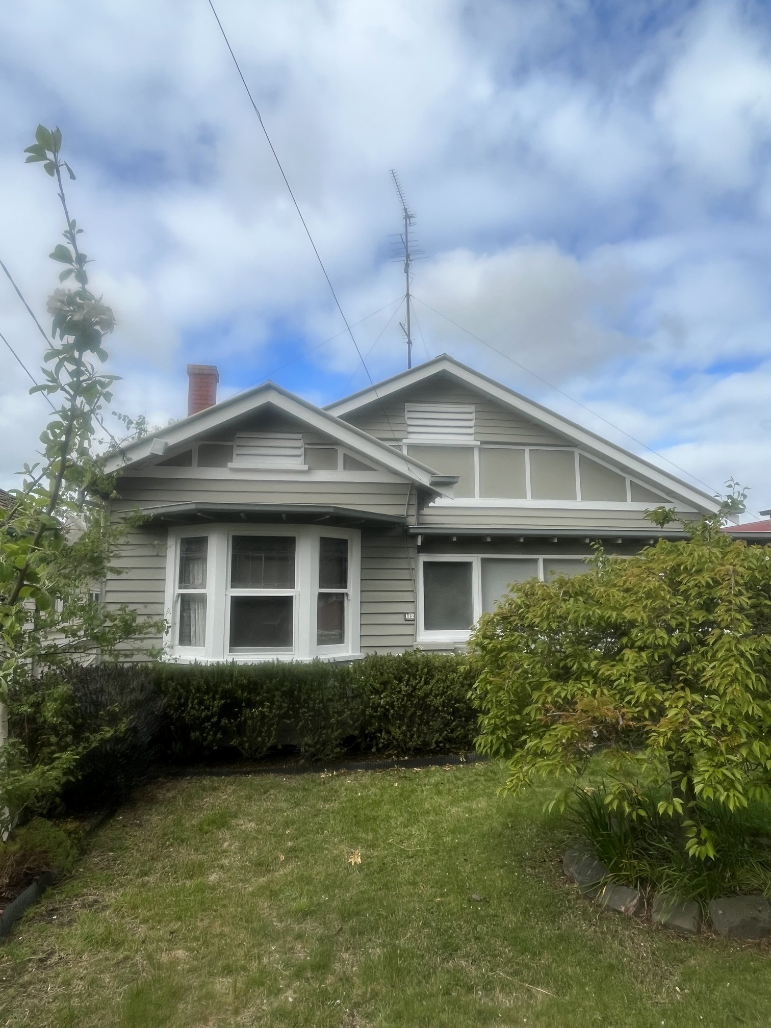 Freshly painted grey weatherboard house in Ballarat