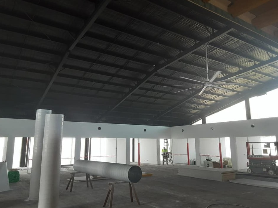 Commercial hall painted with floors protected throughout