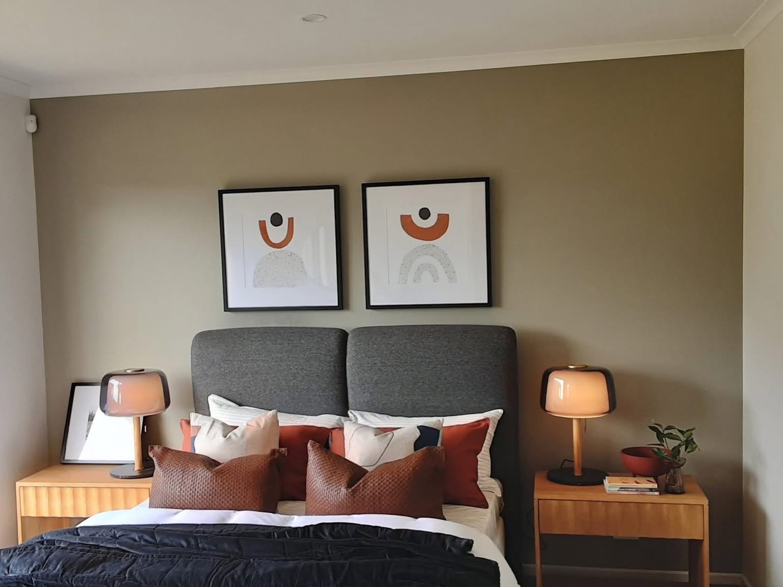 Bedroom interior painted in a soft taupe with crisp white trim