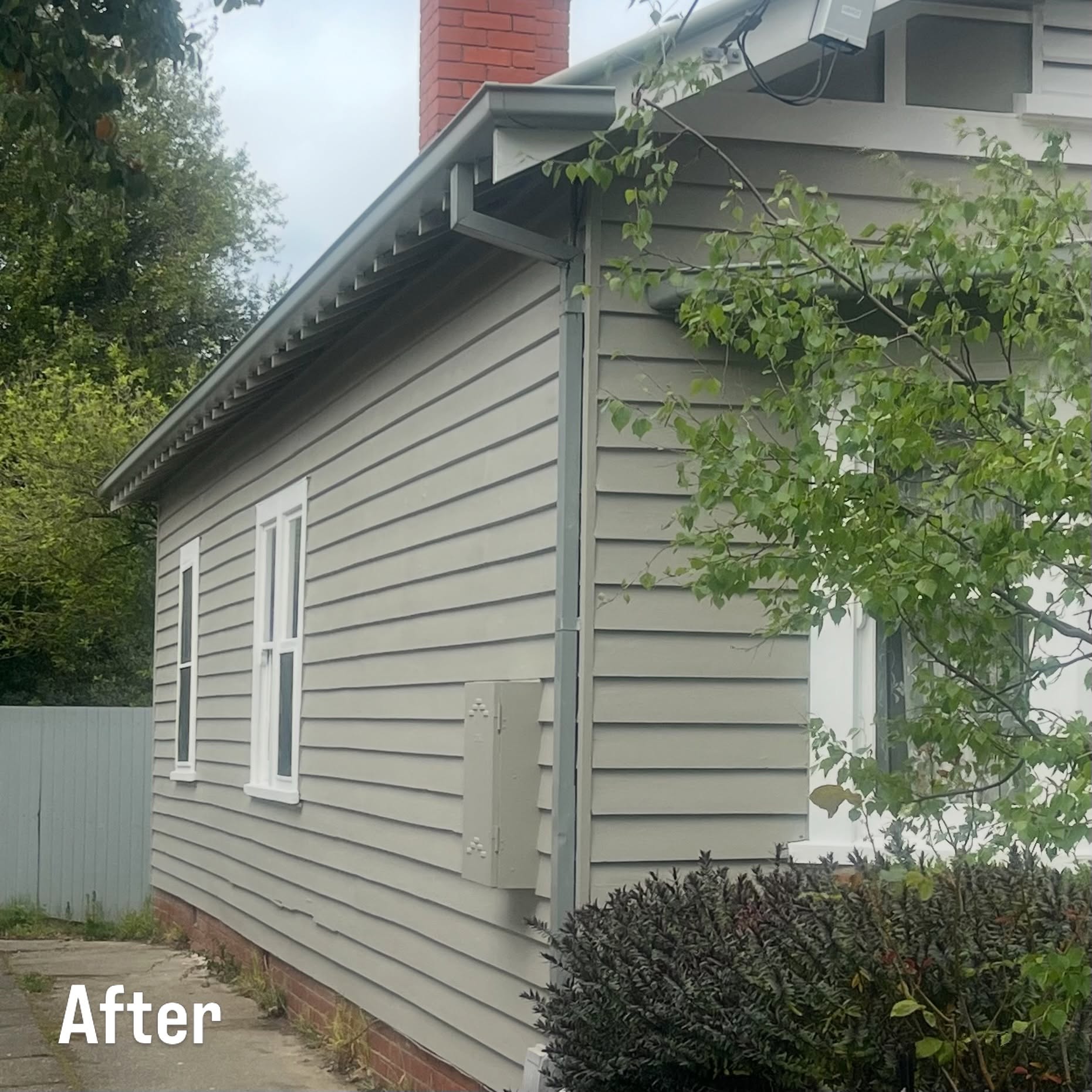 Weatherboard house after restoration and repaint